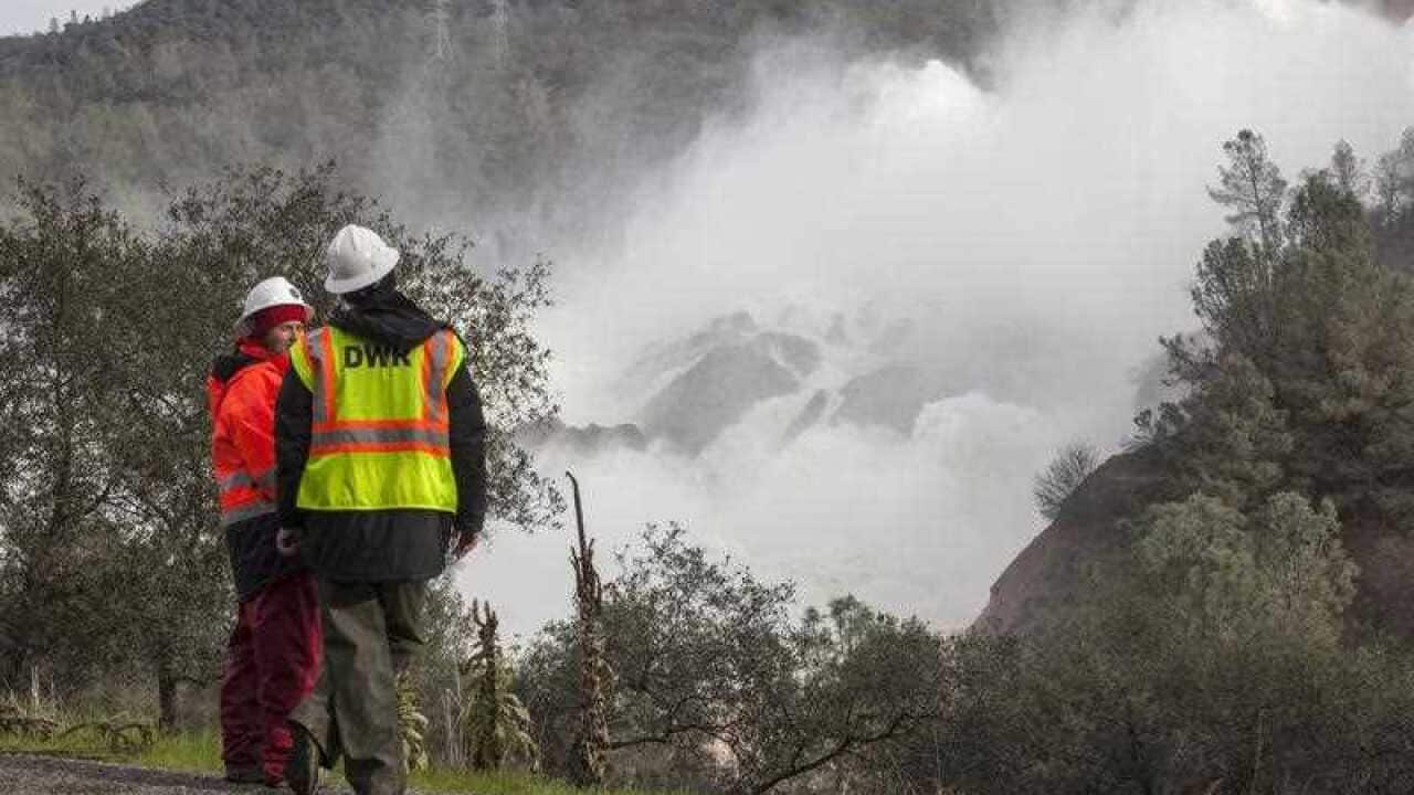 A team from the Department of Water Resource, monitors the section of damaged main spillway at Oroville dam in Oroville, California, USA, 13 February 2017.