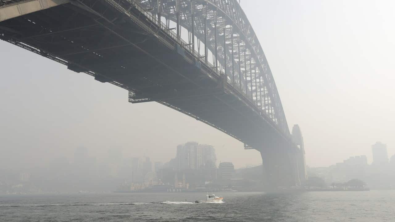 Smoke haze hangs over the Sydney Harbour Bridge in Sydney, Thursday, 21 November, 2019.
