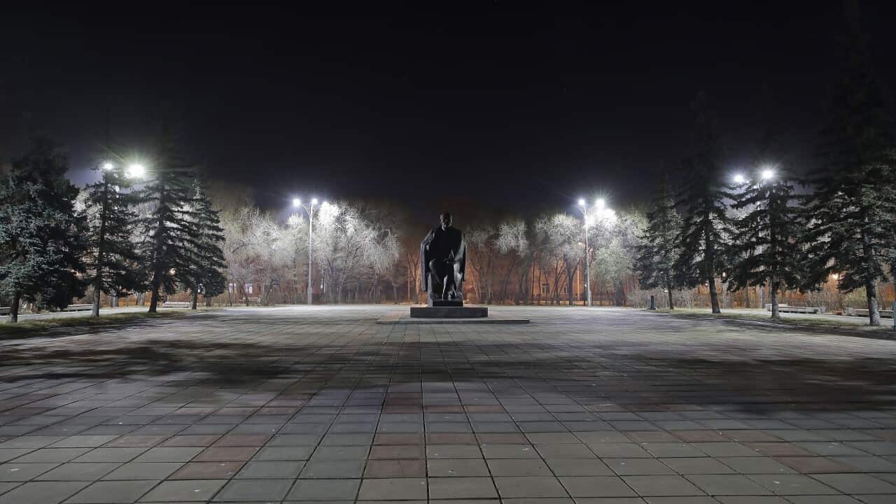 A statue of Vladimir Lenin in an empty square as paid non-working days are introduced in Russia