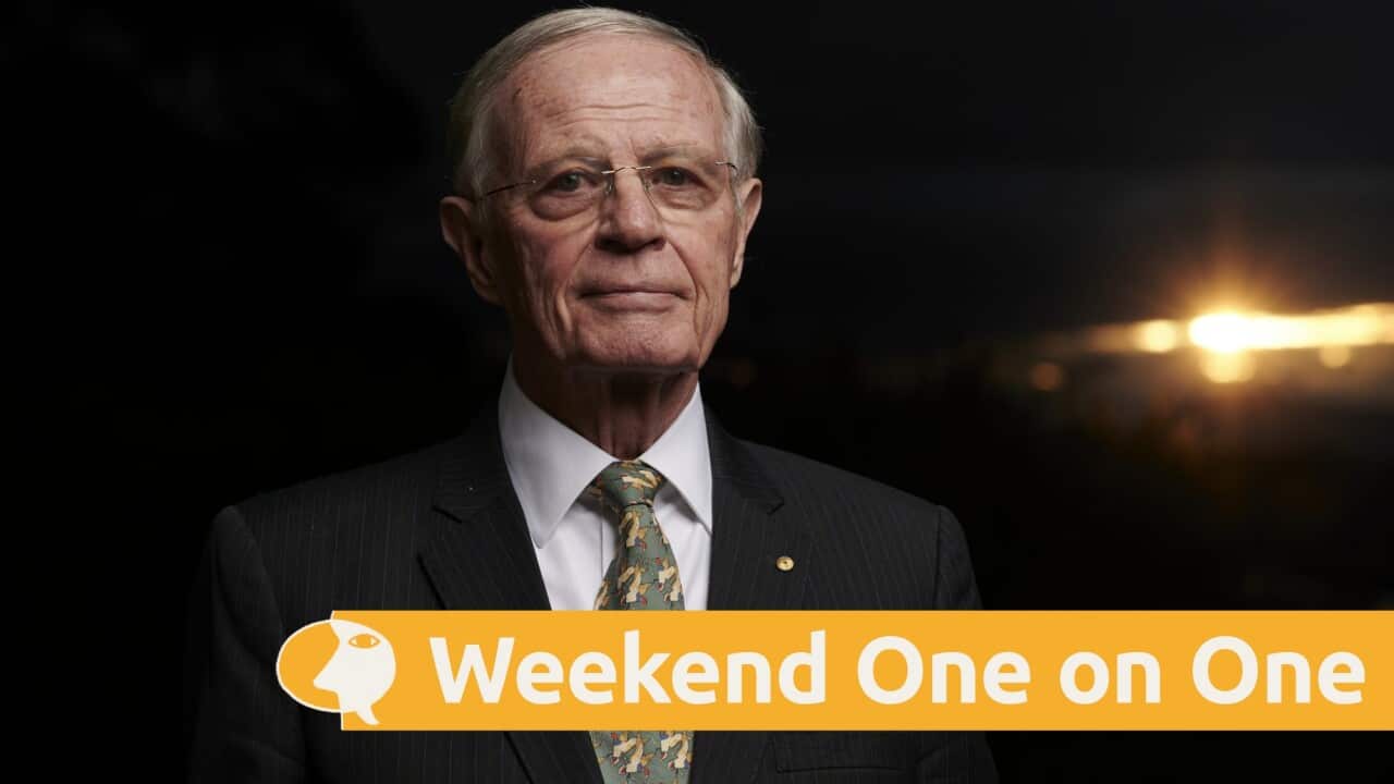 Chris Barrie in a suit looks head on at the camera.