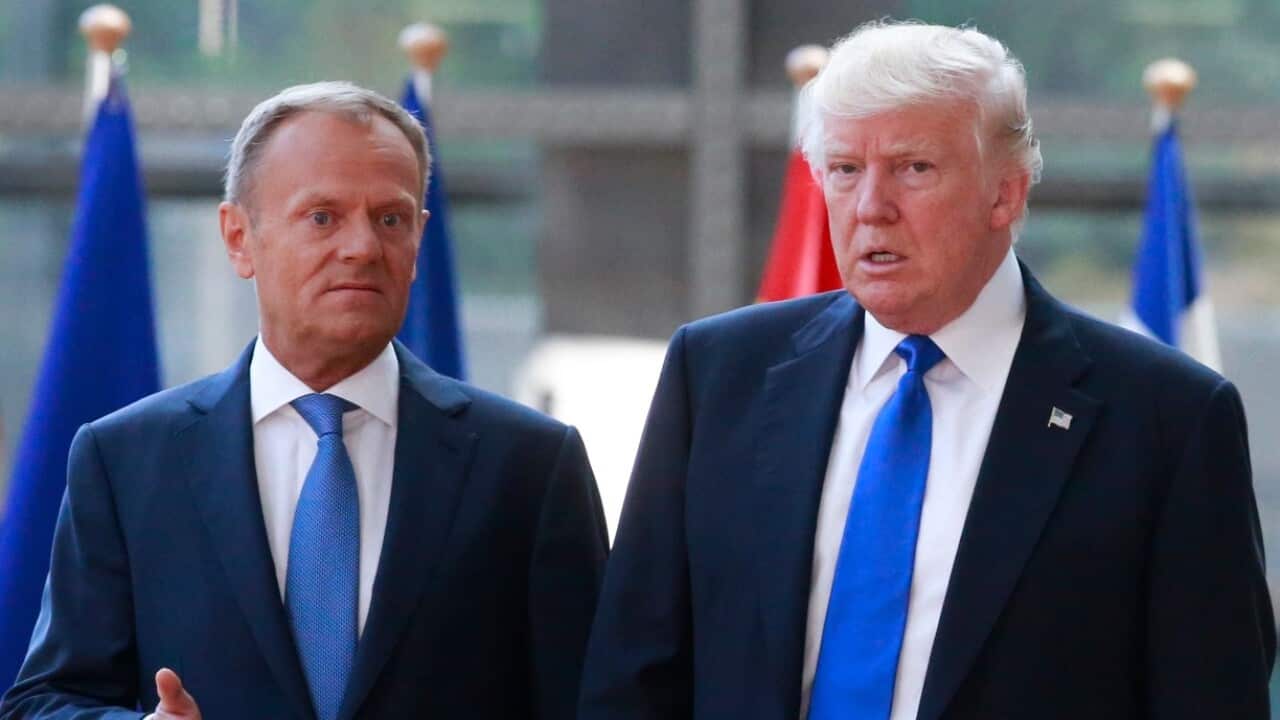 US President Donald J. Trump (R) is welcomed by European Council President Donald Tusk ahead of a meeting with EU leaders at the European Council