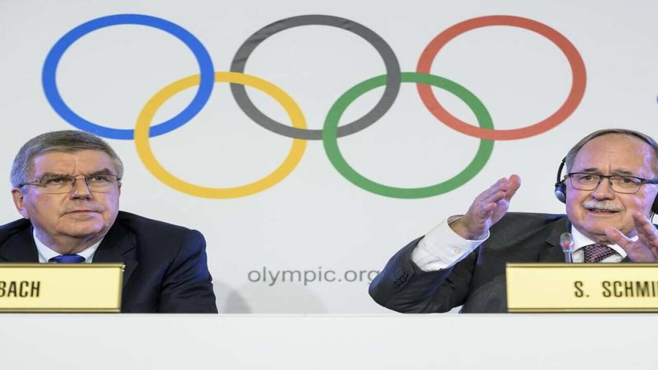 IOC president Thomas Bach (L) and Samuel Schmid.