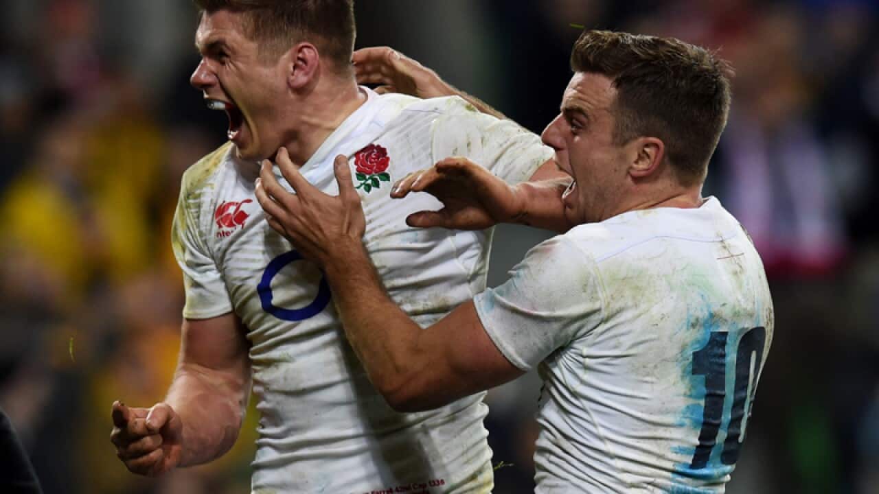 England player Owen Farrell scores a try