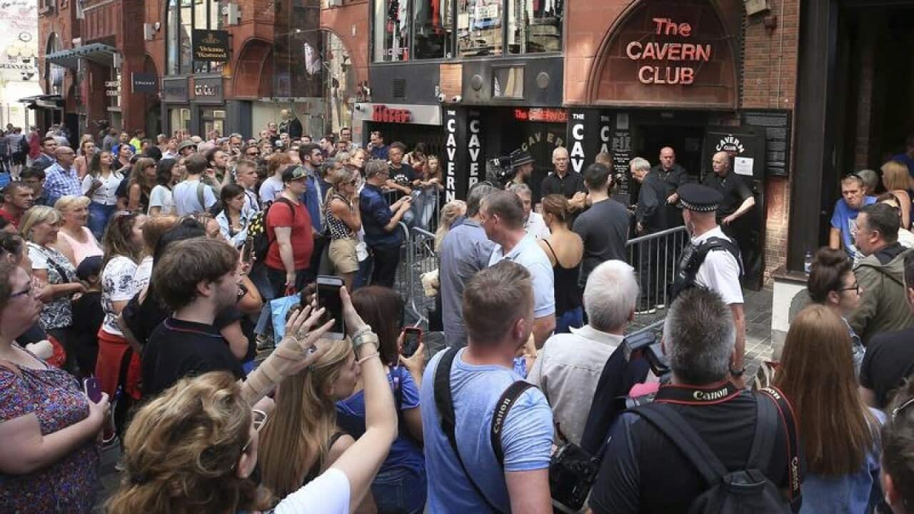 Paul McCartney plays free Cavern Club gig.