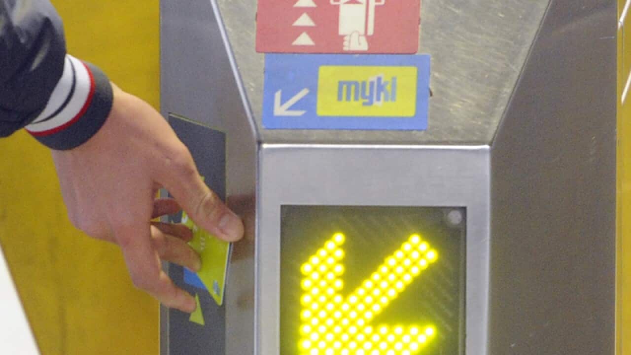A public transport user swipes a MYKI Card in Melbourne