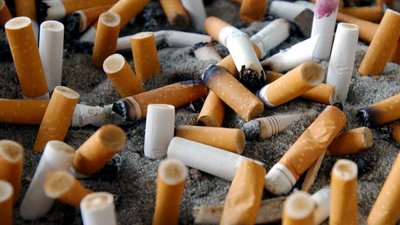 A cigarette tray outside a designated smoking area