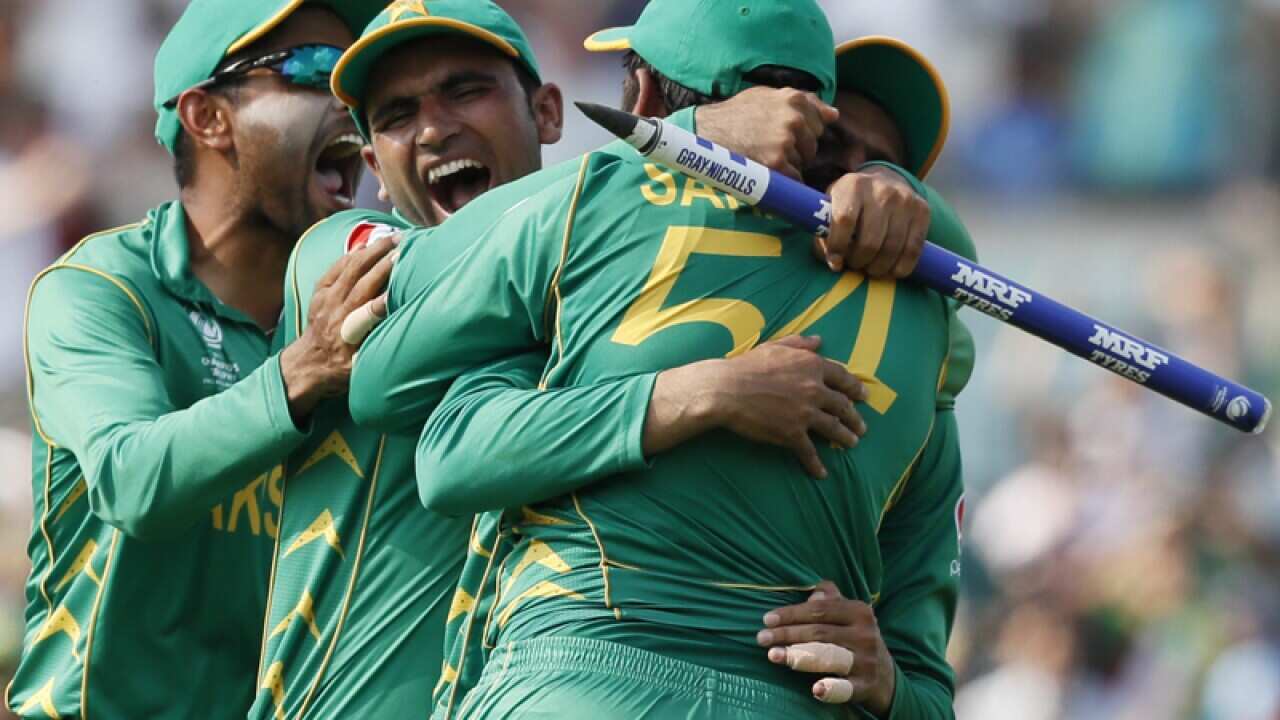 Teammates embrace Pakistan's captain Sarfraz Ahmed