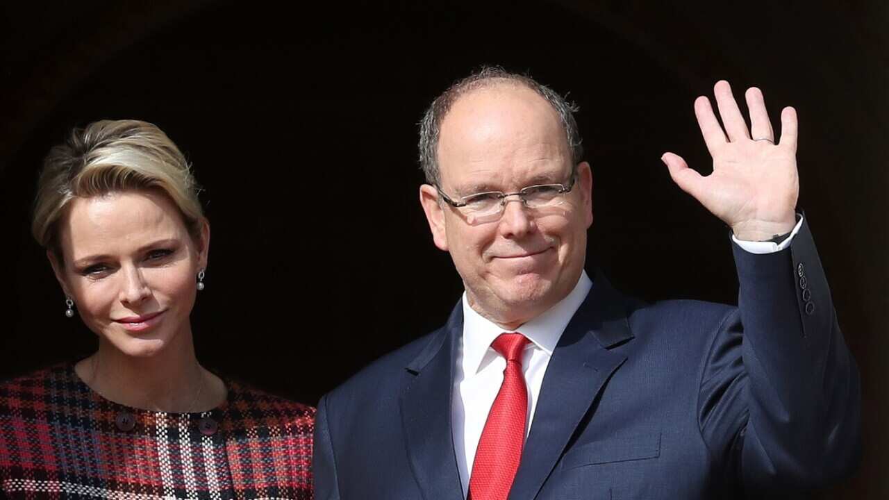 Monaco's Prince Albert II (R) and his wife, Princess Charlene (L)