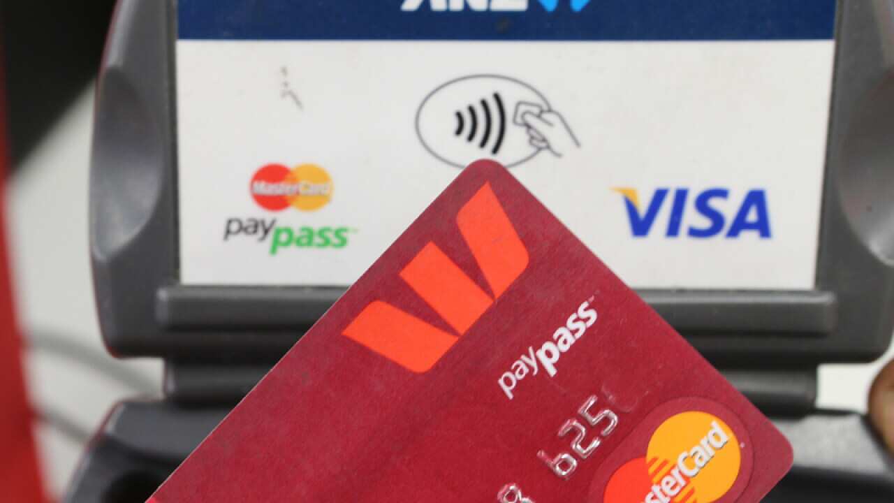 A person uses a credit card