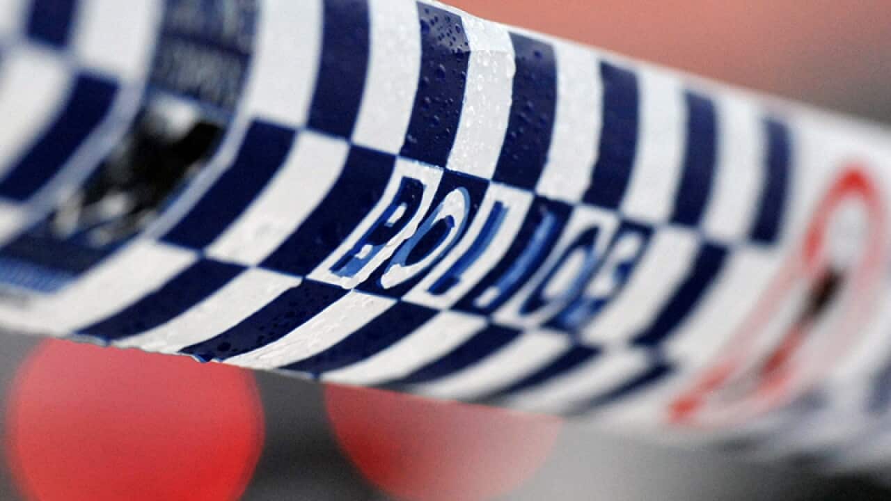 Police tape restricts access to a crime scene