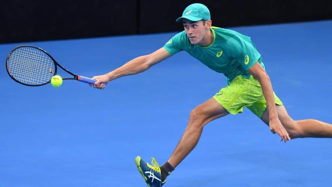 Alex de Minaur of Australia in action against Ryan Harrison.