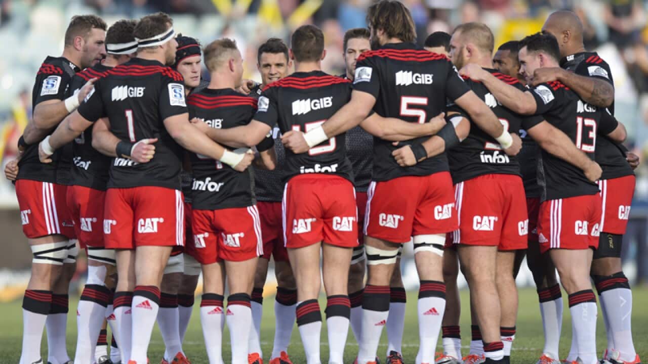 Players of the Crusaders stand together