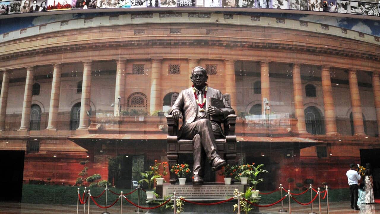 New Delhi India 05 APRIL 2022, A statue of Bhimrao Ramji Ambedkar, an Indian jurist, economist and Dalit leader who headed the committee drafting the Constitution of India from the Constituent, sits near the Indian Parliament Building in New Delhi, India on Apr. 5, 2022.