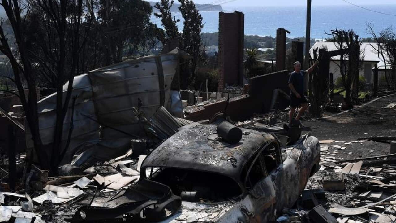 A general view of burnt cars and properties in Tathra, NSW.