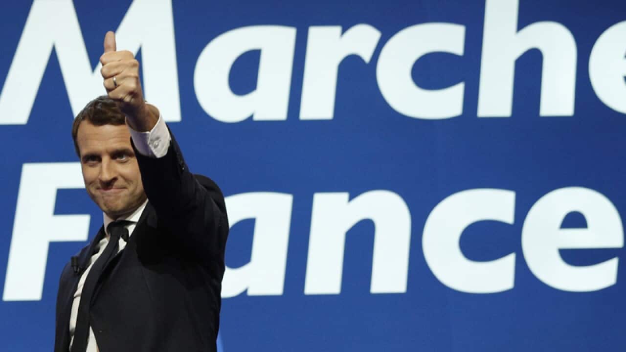 Emmanuel Macron celebrates in Paris