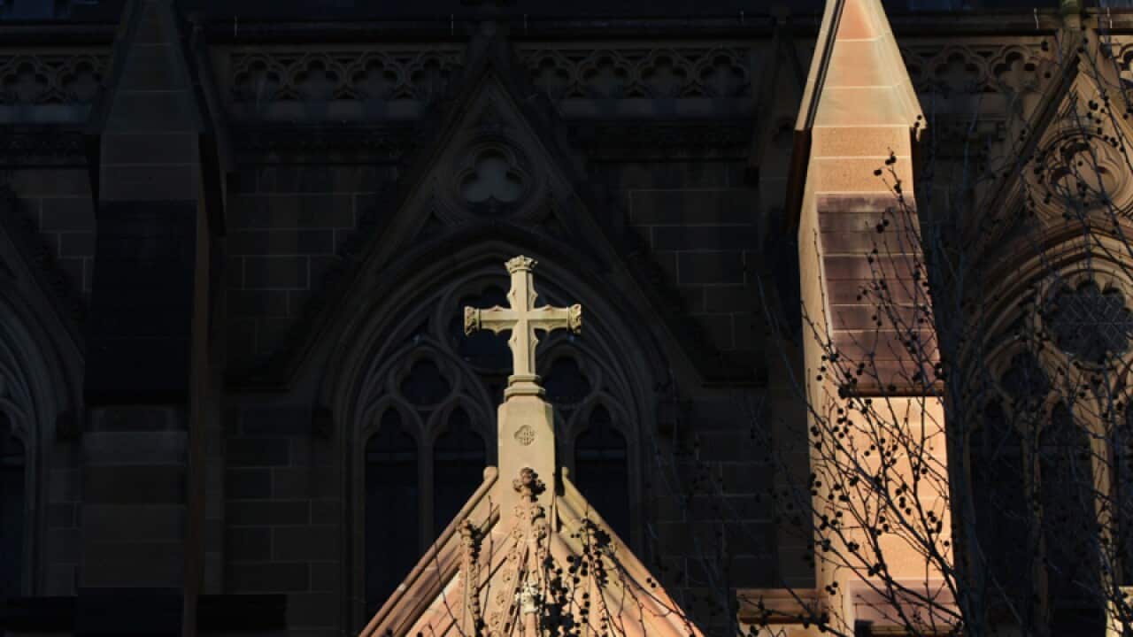 A cross on the exterior of a church