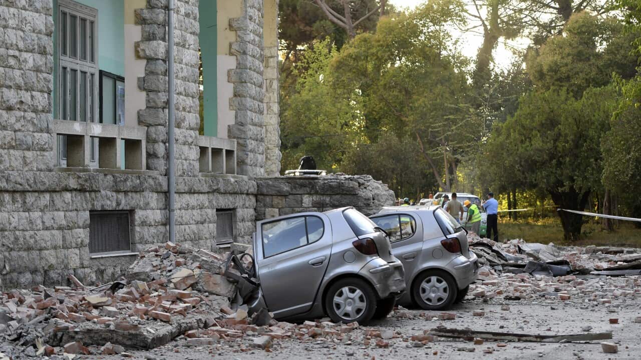 Damaged cars outside the Faculty of Geology building after an earthquake in Tirana.