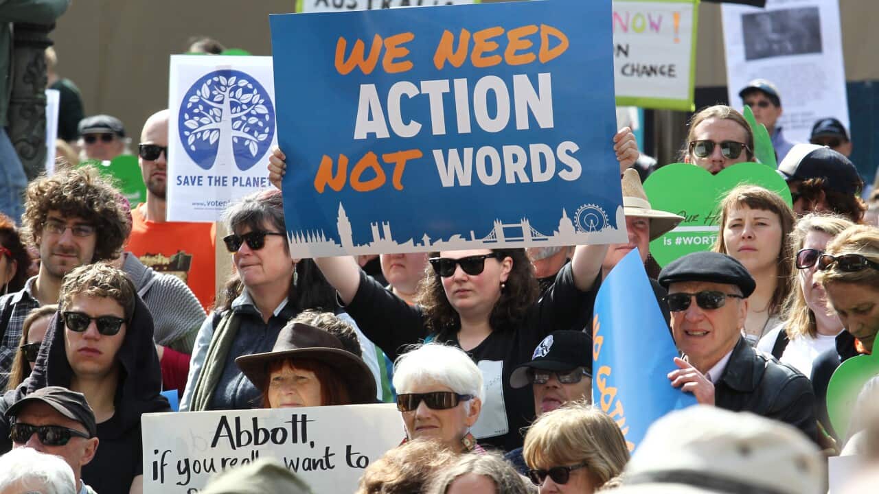 Thousands of people march in a climate change rally in Melbourne. Sunday, September 21, 2014. Rallies were held around the country for people demanding action against climate change. (AAP/David Crosling)