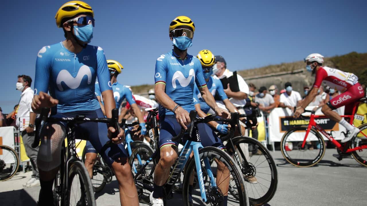 Spanish rider Alejandro Valverde (C) of Movistar team before the start of the 10th stage of the Tour de France.