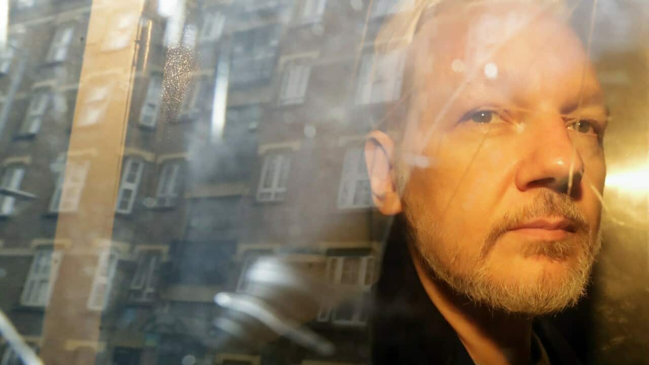 WikiLeaks founder Julian Assange is taken from court, where he appeared on charges of jumping British bail seven years ago, in London.