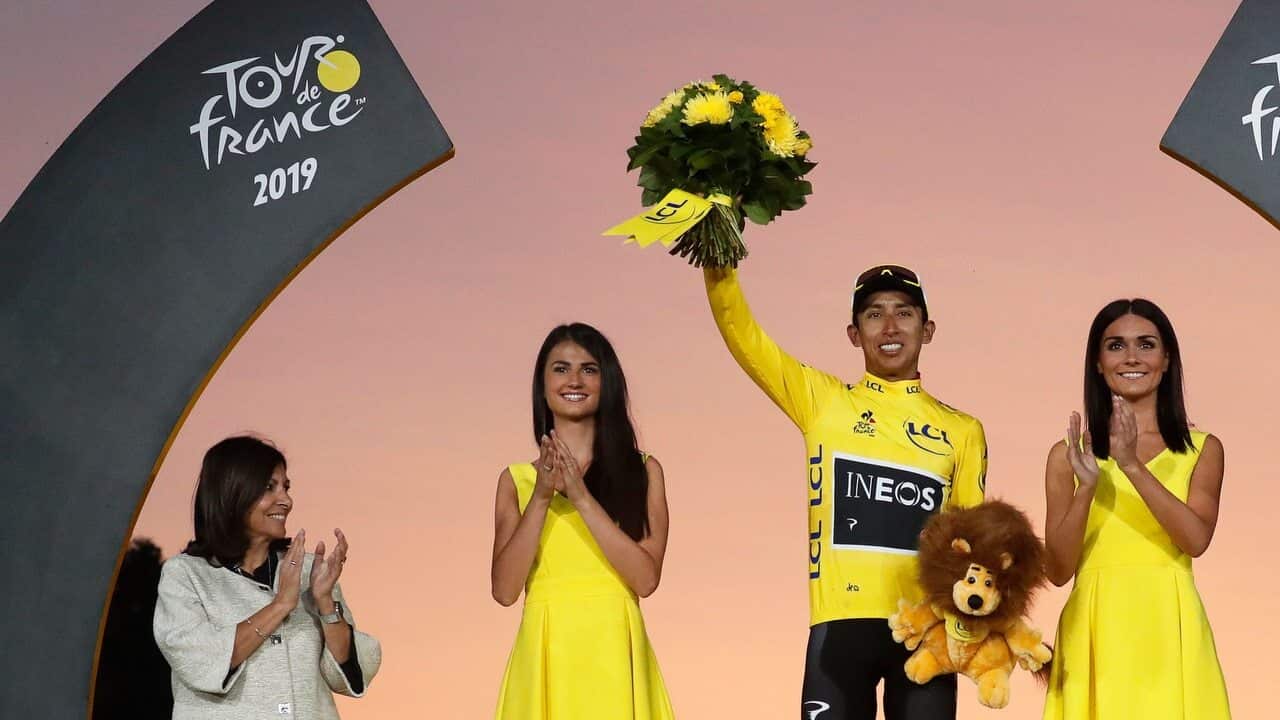 Colombia's Egan Bernal of Team Ineos celebrates winning the 106th edition of the Tour de France cycling race.