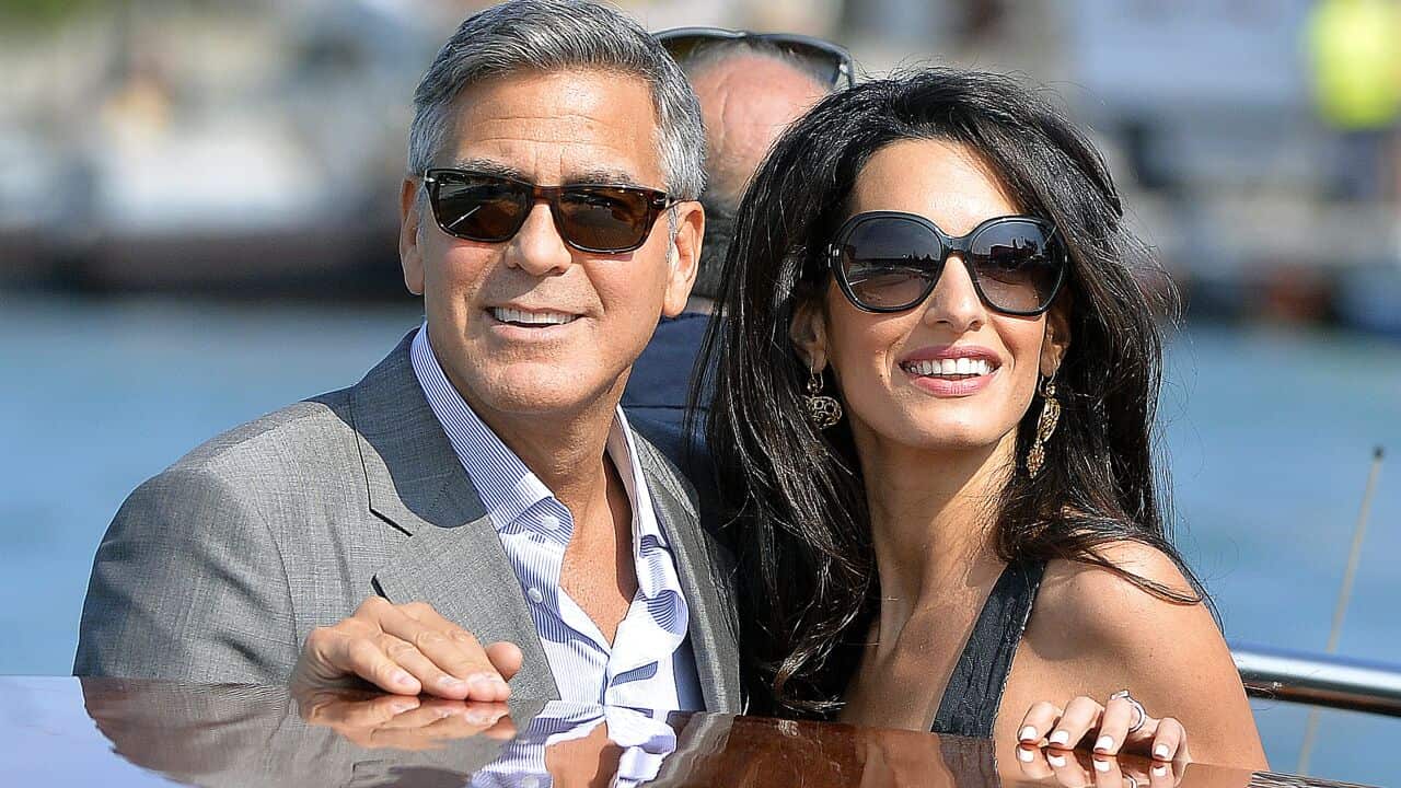 George Clooney and Amal Alamuddin, his Lebanon-born British fiancee take a taxiboat upon their arrival in Venice (Getty)