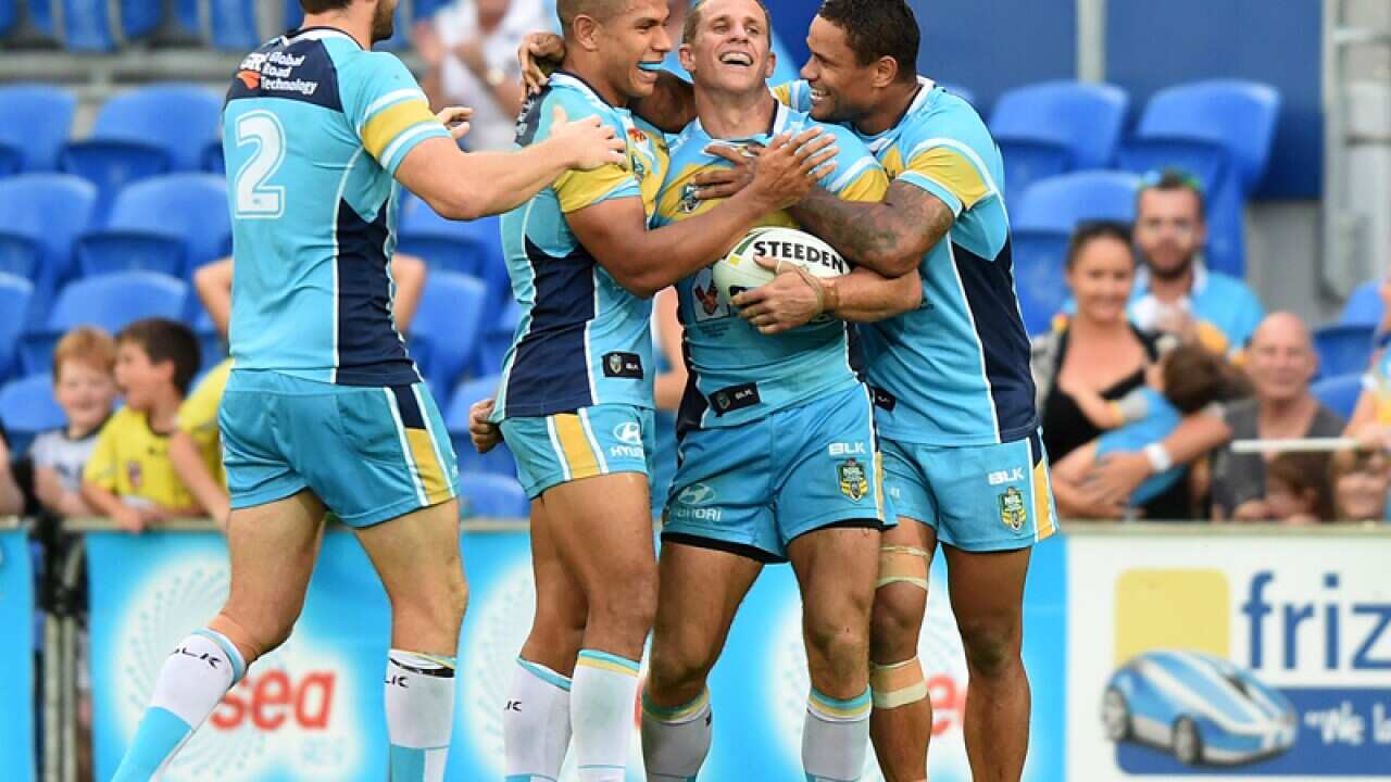 Titans player William Zillman (centre) celebrates