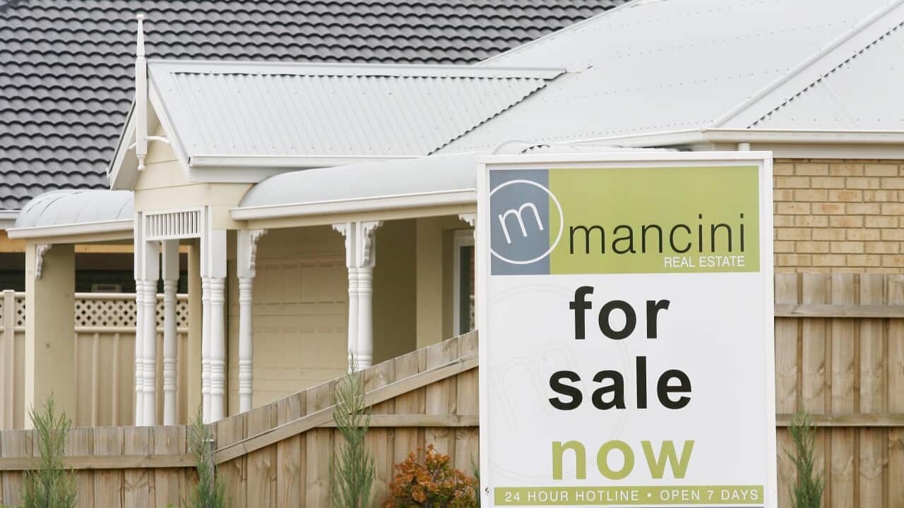 'For sale now' sign in front of house