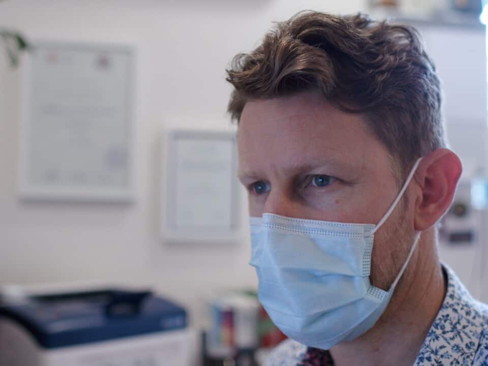 A Doctor wearing a mask in his clinic in the Northern Rivers region of New South Wales