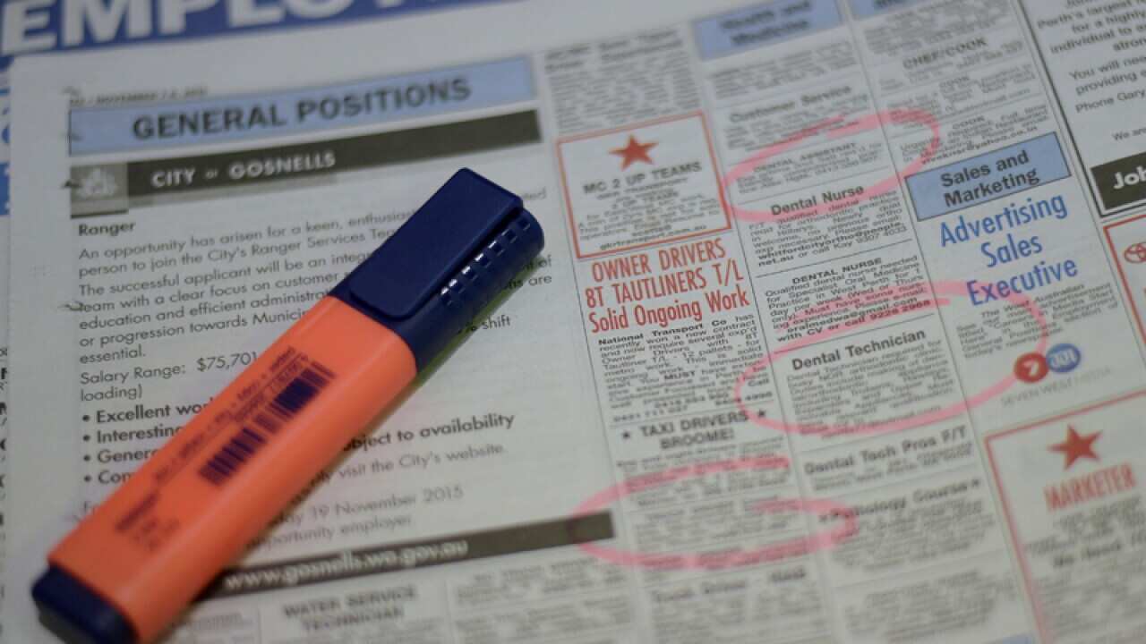 Job adverts are seen in a weekend newpaper in Canberra
