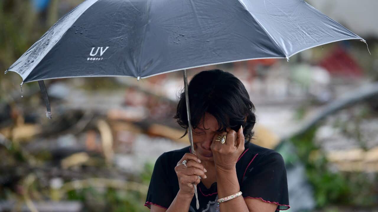typhoon pilippines woman cry afp.jpg