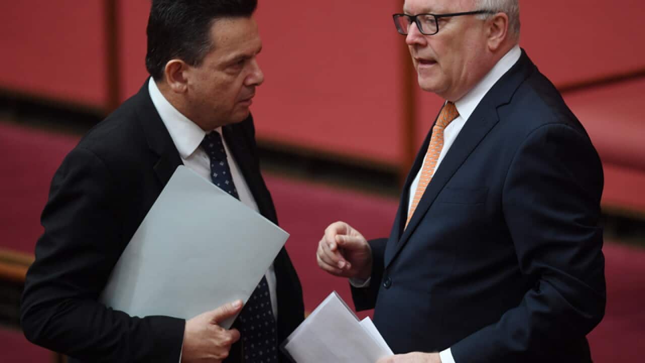 Attorney-General George Brandis (right) and Senator Nick Xenophon