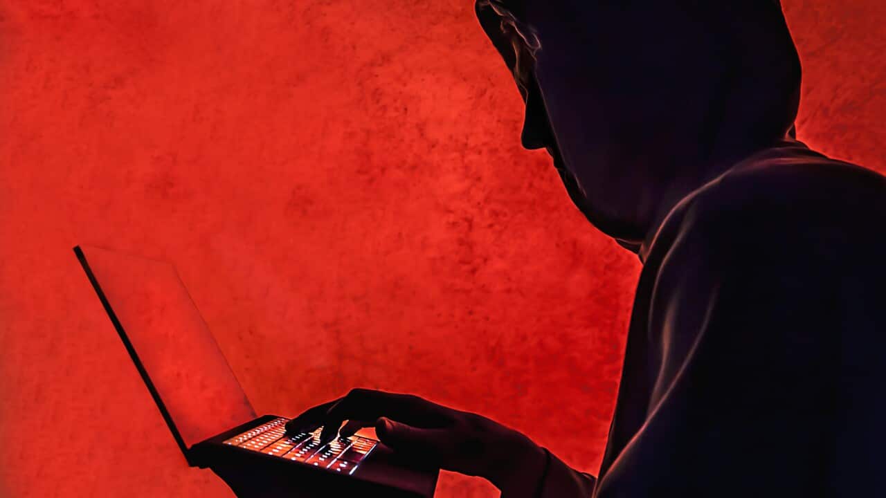 Man's silhouette, red background.