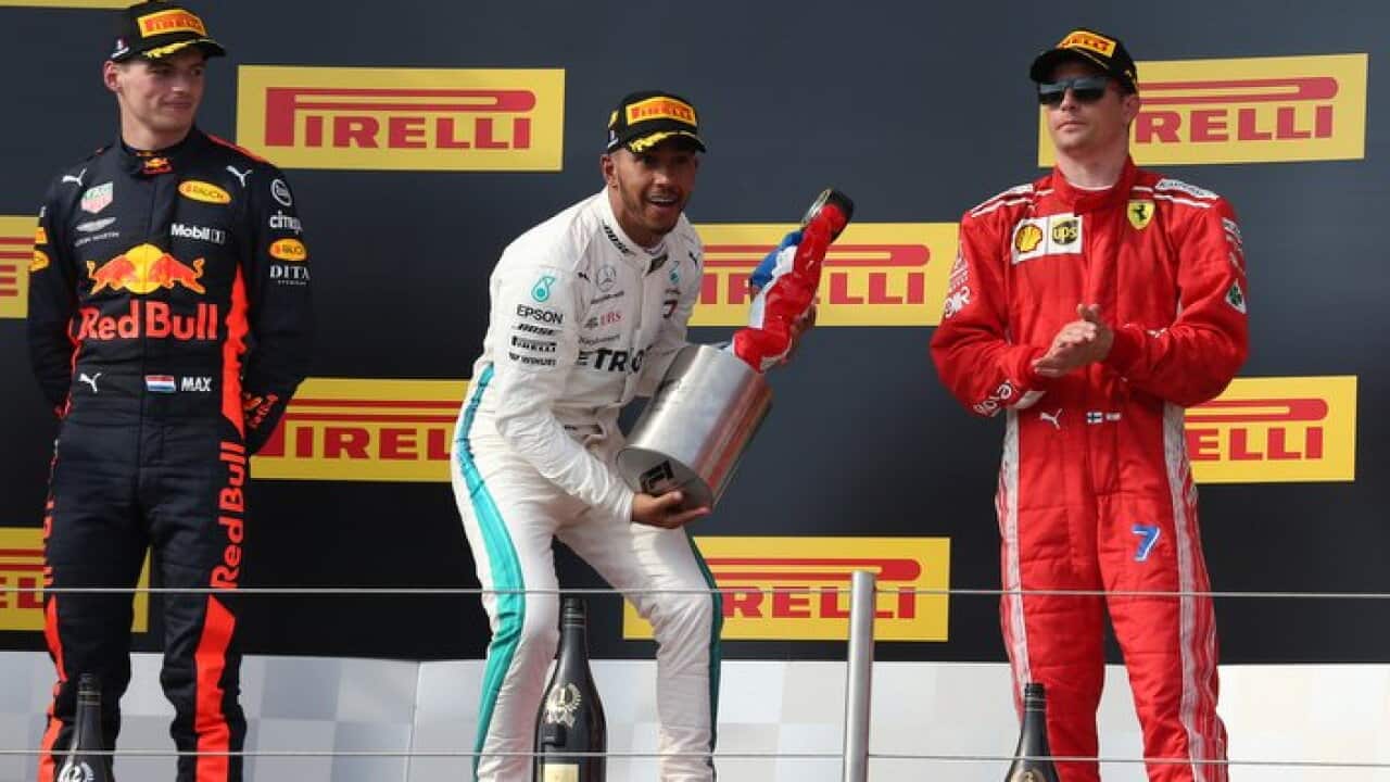 The podium (L to R): Max Verstappen (NLD) Red Bull Racing, second, Lewis Hamilton (GBR) Mercedes AMG F1, race winner, Kimi Raikkonen (FIN) Ferrari, third.