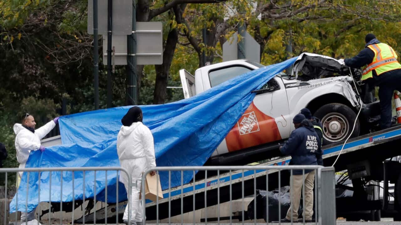The Home Depot truck used in the bike path attack is removed from the crime scene, Wednesday, Nov. 1, 2017, in New York. (AP Photo/Mark Lennihan)