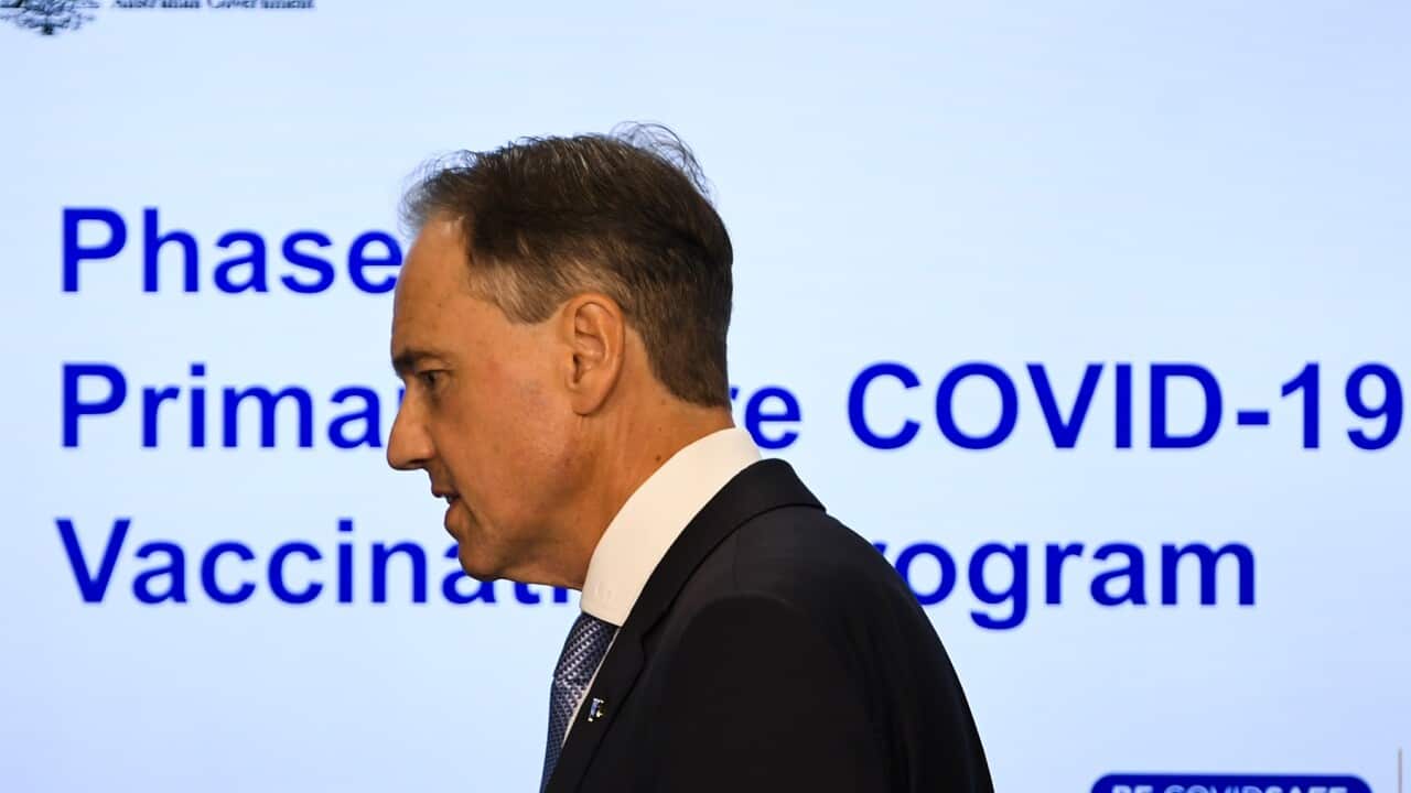 Australian Health Minister Greg Hunt arrives to speak to the media during a press conference at Parliament House in Canberra, Wednesday, March 17, 2021. (AAP Image/Lukas Coch) NO ARCHIVING