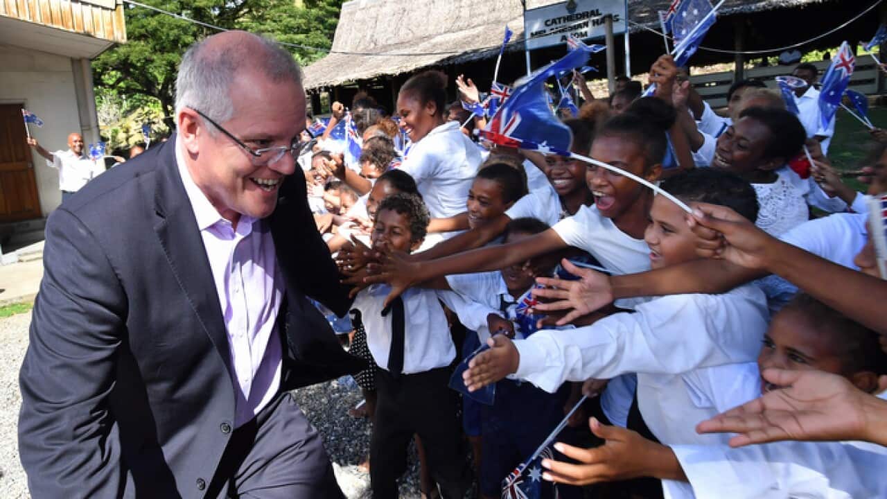 Australian Prime Minister Scott Morrison meets students during his visit to the Solomon Islands.