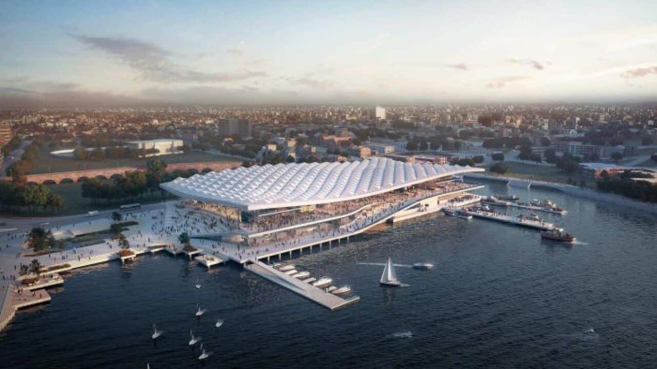 The new building will sit over the water and feature a roof inspired by fish scales