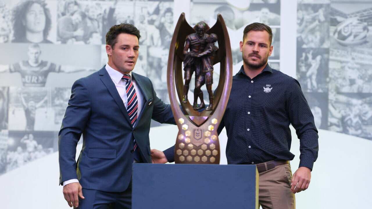 Cooper Cronk of the Sydney Roosters and Aiden Sezer of the Canberra Raiders