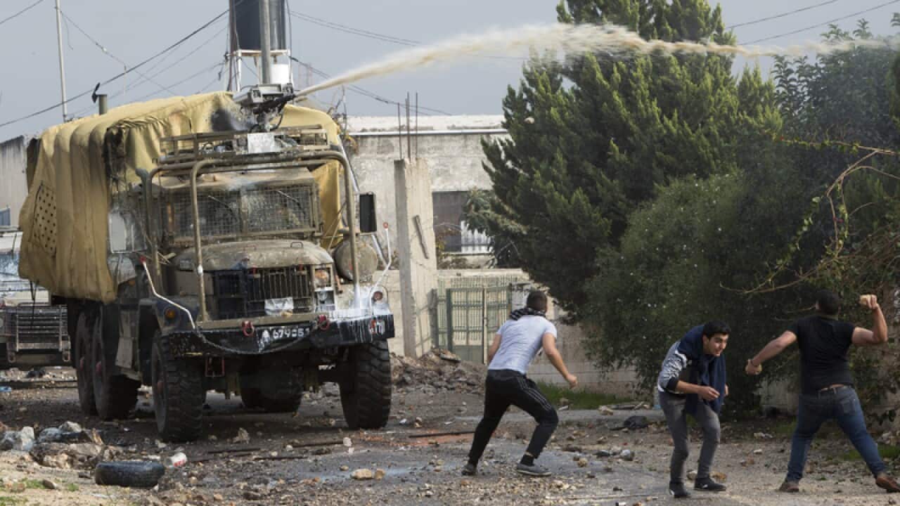 Israeli security forces spray with a chemical called "Skunk".