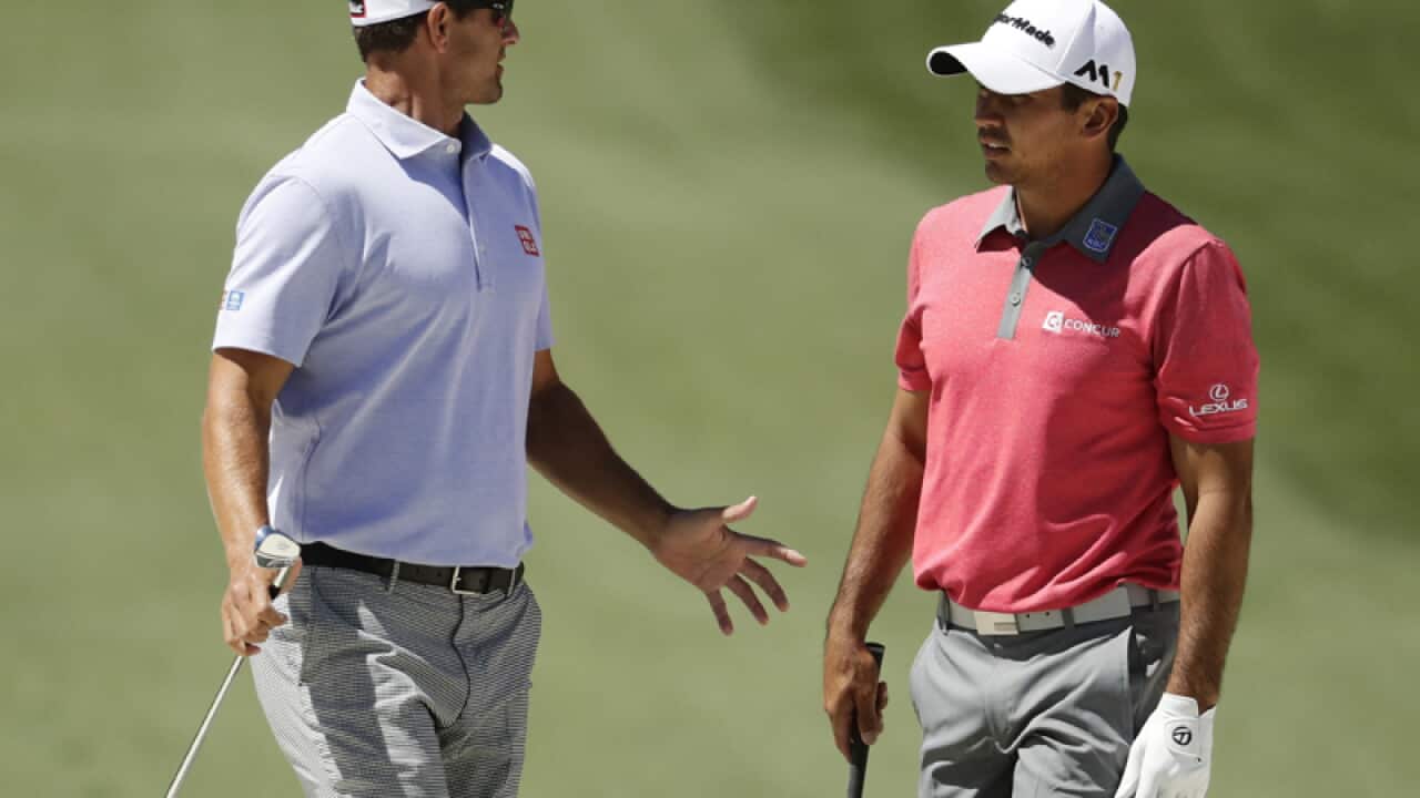 Australian golfers Adam Scott (L) and Jason Day