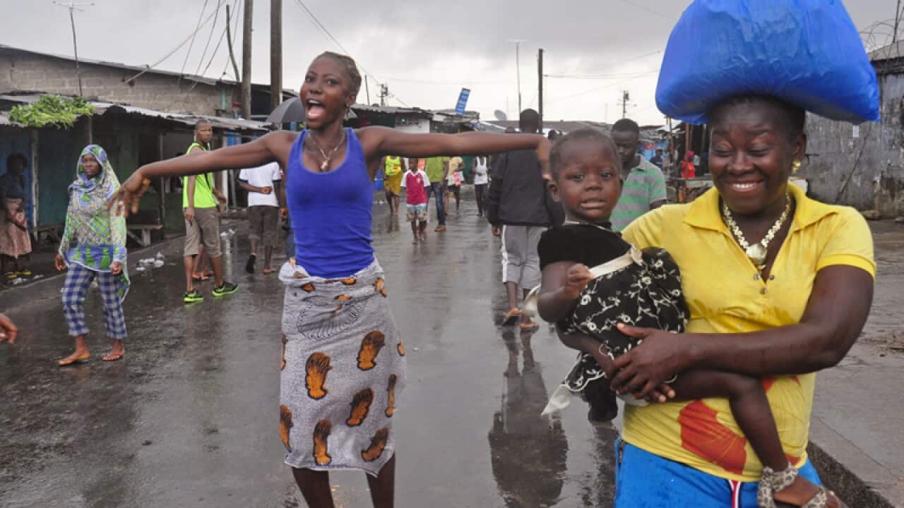 A woman reacts in Liberia