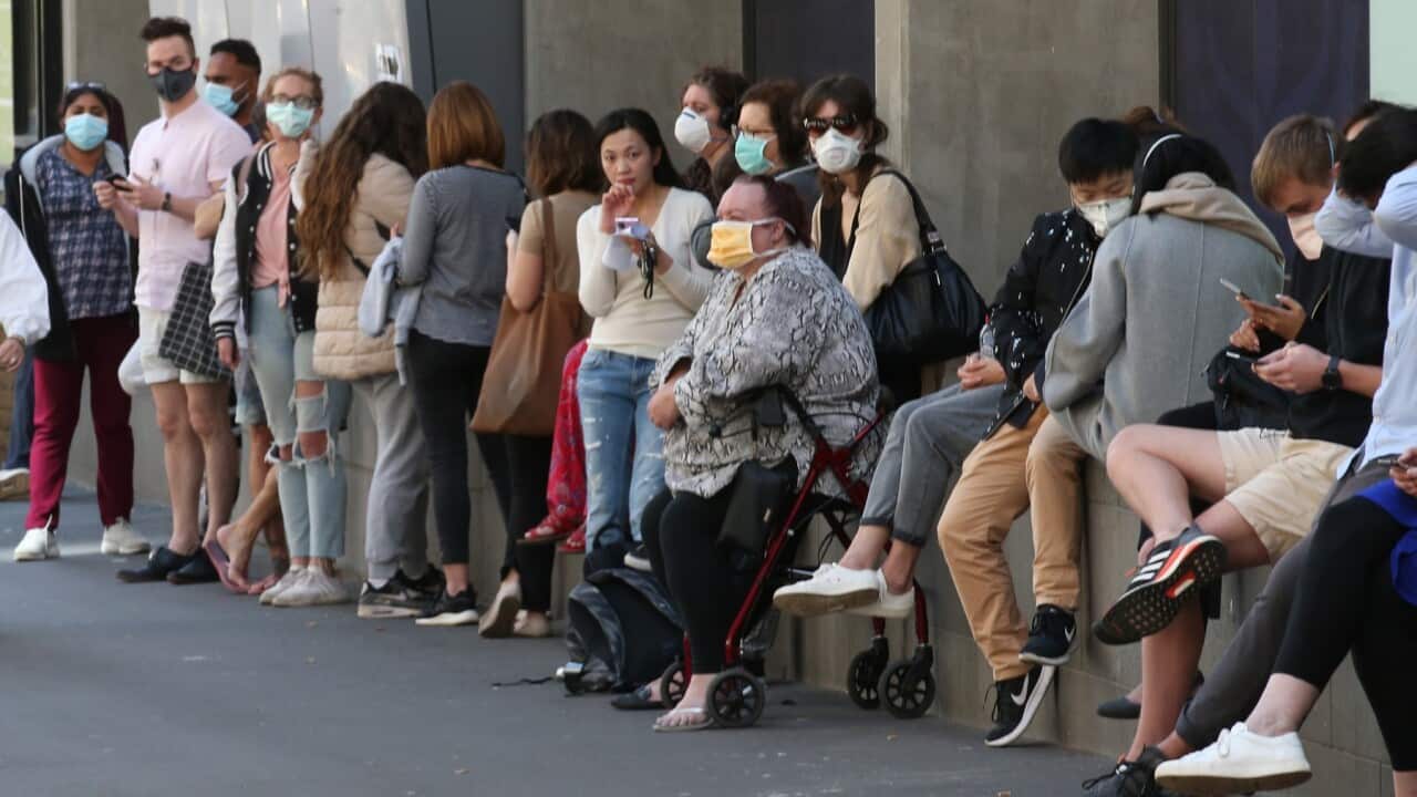 People line up outside the Royal Melbourne Hospital for coronavirus testing