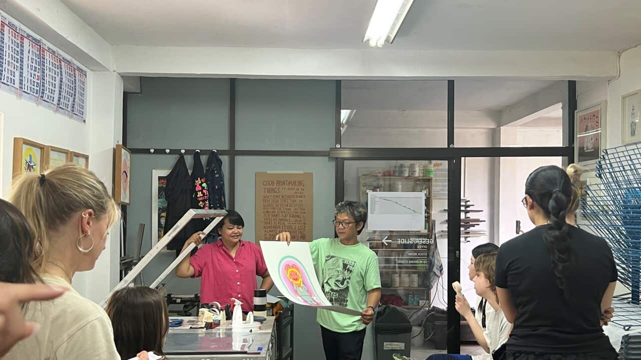 In the studio of KRACK! Collective, Sukma Smita (in red shirt) and Rudi Hermawan (in green T-shirt), explained about printmaking process to visiting Monash University students - 2022. Photo by Dr Michelle Antoinette.