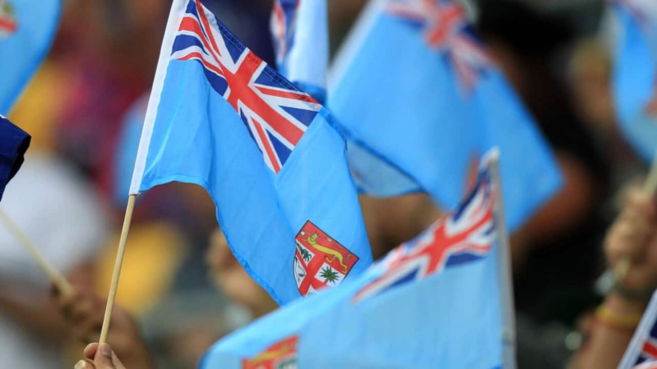 Fijian flags are waved during pool play