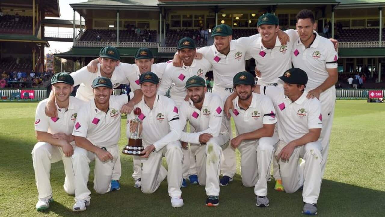 The Australian cricket team celebrates with the Frank Worrell trophy after winning the Test series on the final day of the third cricket Test match played in Sydney on January 7, 2016.