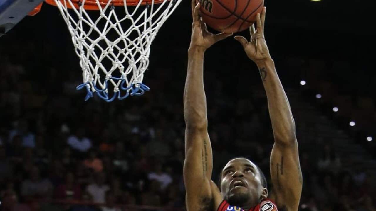 Bryce Cotton of the Wildcats drives to the basket