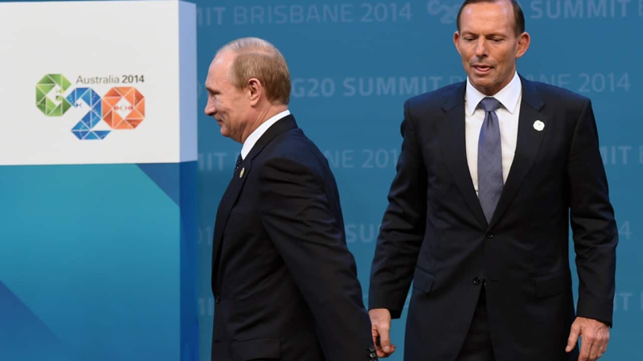 Prime minister Tony Abbott (R) and Russian President Vladimir Putin