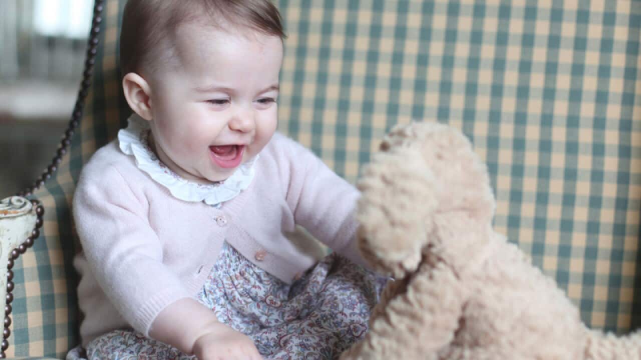 Princess Charlotte with her cuddly toy dog