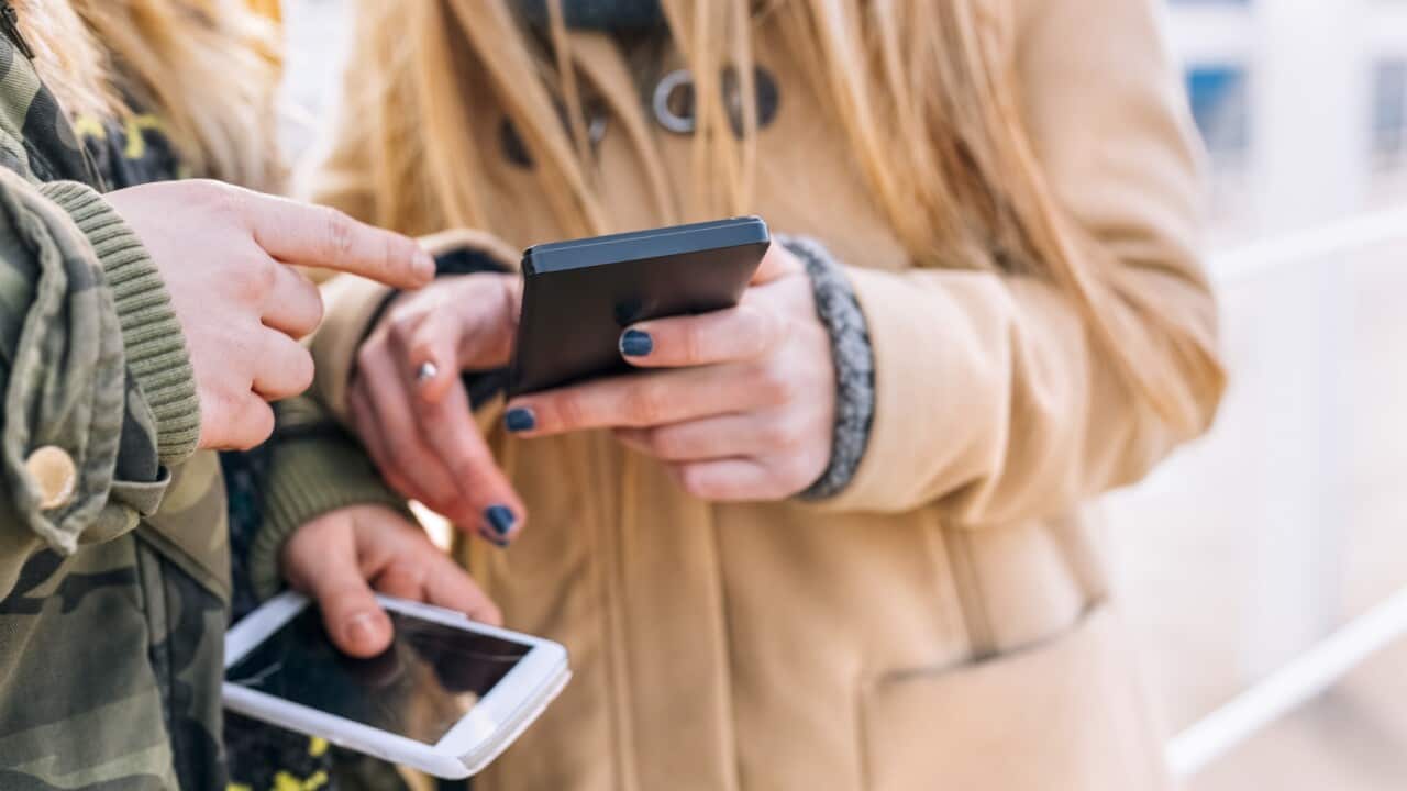 Teenagers on their phones